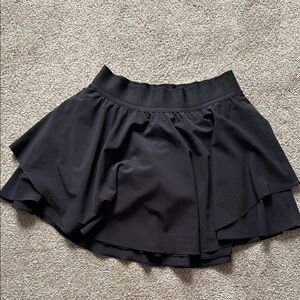 Lululemon black tennis skirt with built in shorts. Size 6. Never worn.